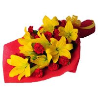Best Rakhi Gifts Orange Lily 12 Red Carnation Flower with Rakhi in India