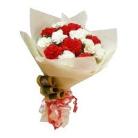 Send Rakhi with Red and White Carnation Bouquet 12 Flowers to India