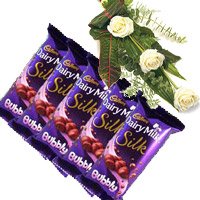 Rakhi Gift hamper delivery in India Cadbury Silk Bubbly Chocolate, White Roses with Rakhi