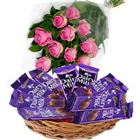 Send Rakhi Gift hamper to India Dairy Milk Basket 12 Chocolates With 12 Pink Roses